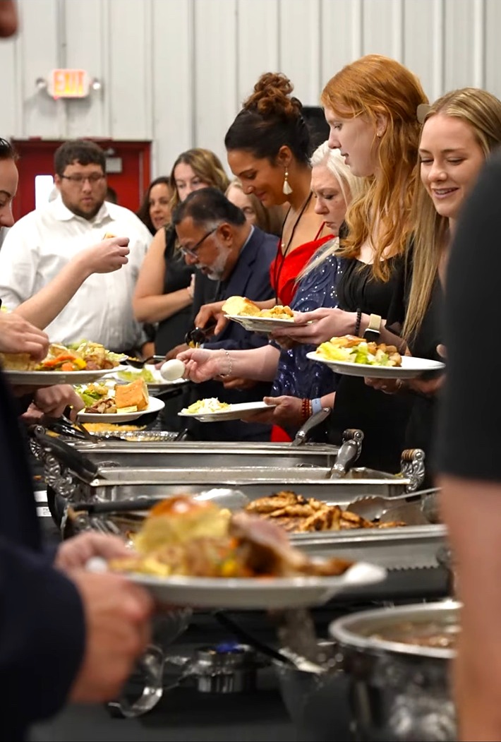 Guests enjoying a Coachman catered buffet