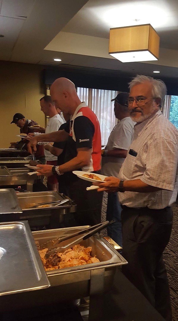 Guests selecting food from a Coachman buffet