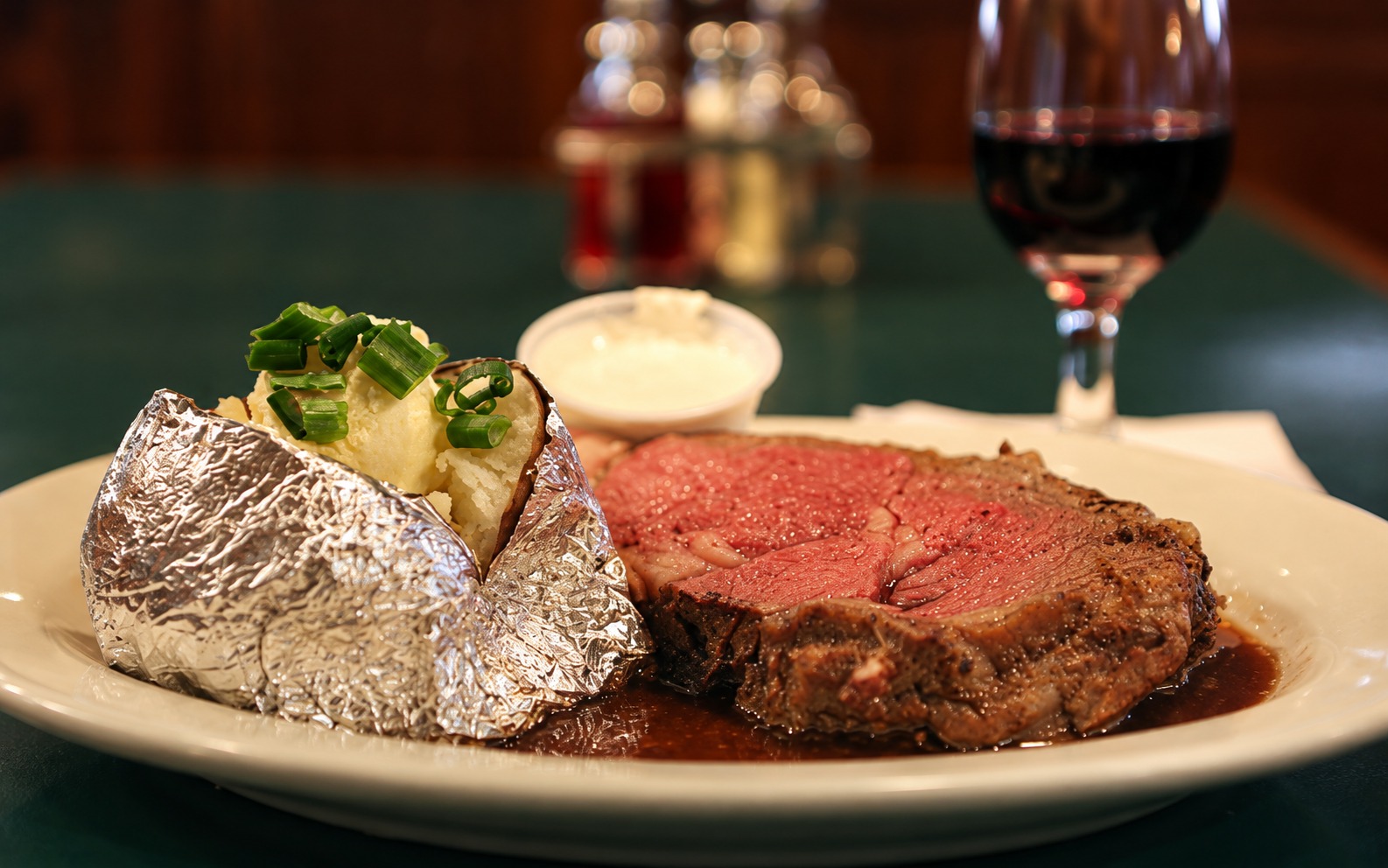 Prime rib dinner with a loaded baked potato