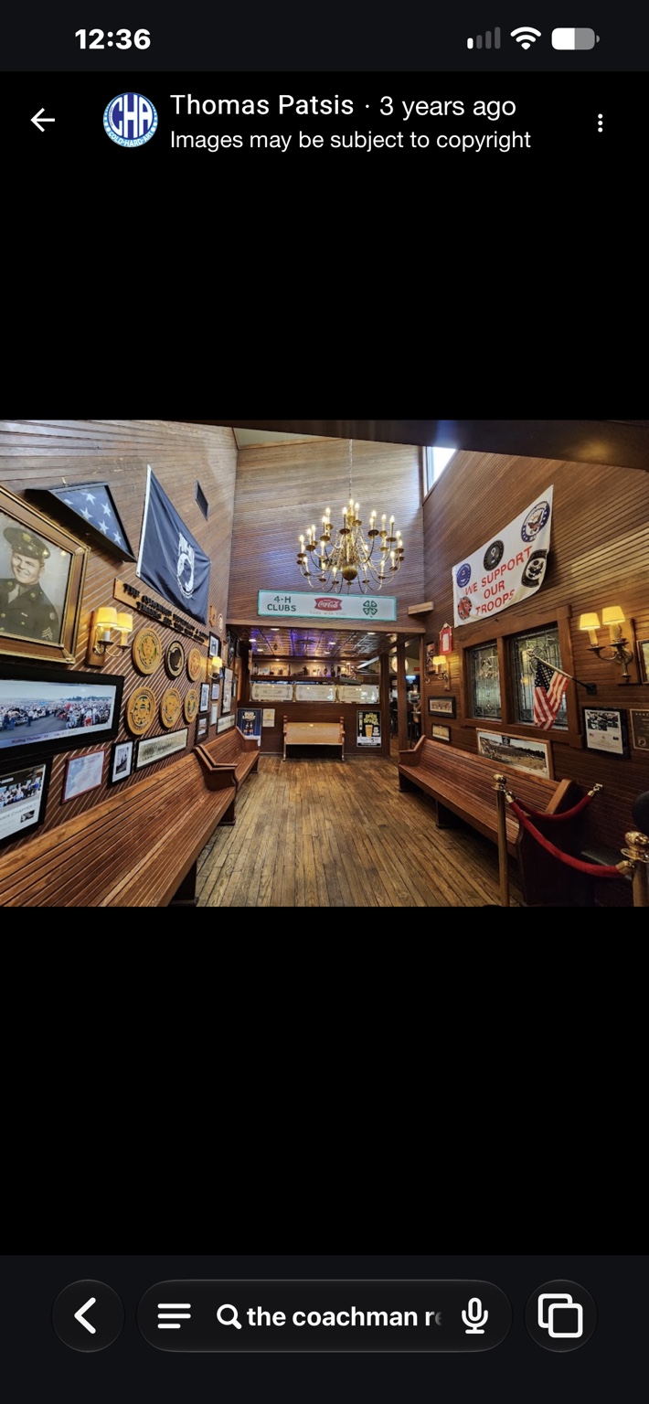 Military remembrance displays in The Coachman entryway